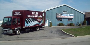 TELEP Pianos & Clocks Warehouse store with piano moving truck